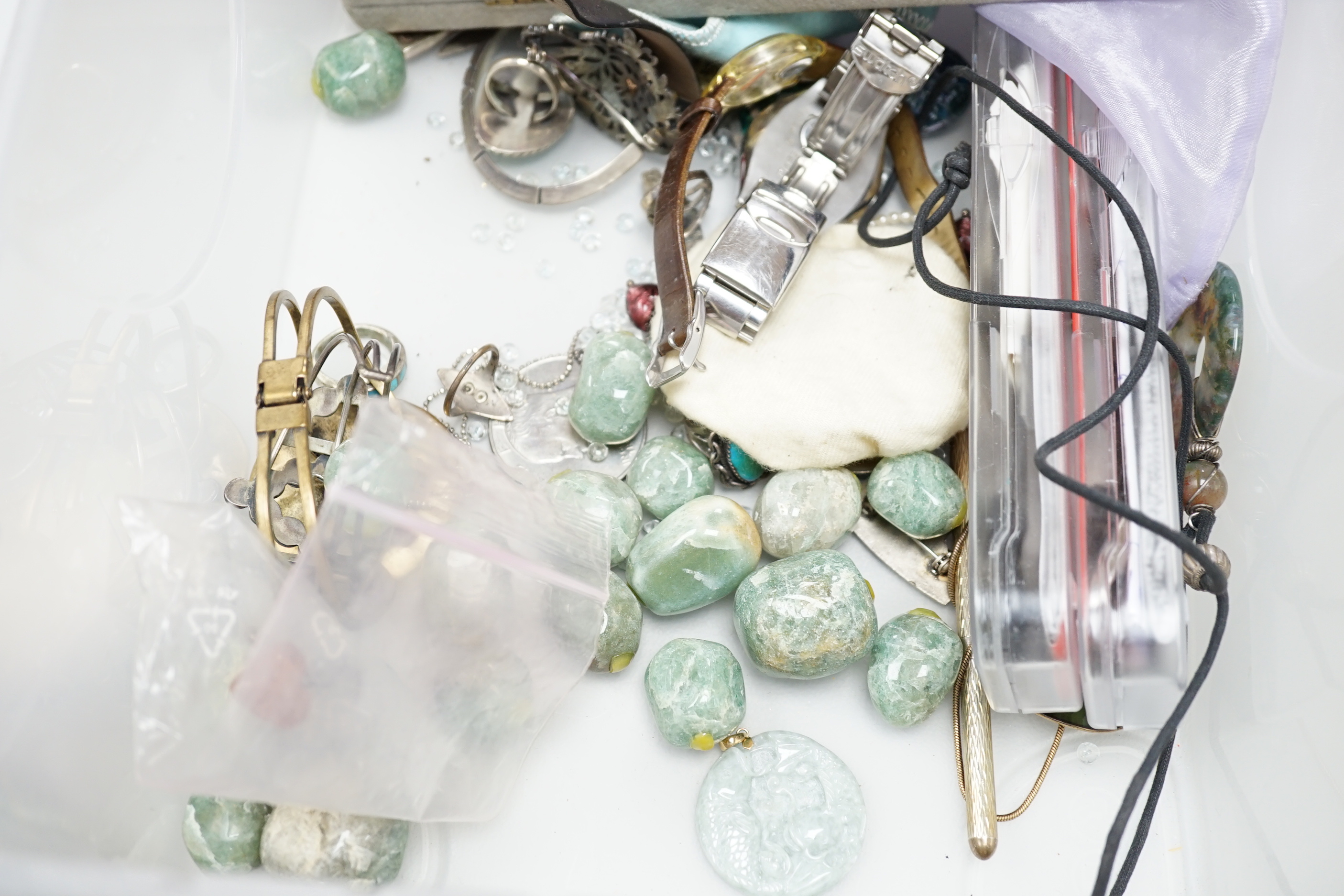 A quantity of assorted costume jewellery, necklaces, simulated amber, paste pendant, silver ingot pendant, Enico Sport watch, jargoon? set brooch, etc.